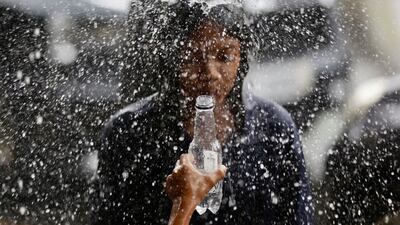 Children play during a downpour in Las Pinas City, Metro Manila, Philippines. EPA