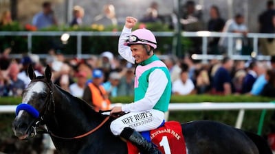 Jockey Mike Smith celebrates atop Arrogate after winning the $12 Million Pegasus World Cup Invitational at Gulfstream Park on January 28, 2017 in Hallandale, Florida. Cliff Hawkins / Getty Images