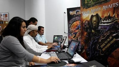 Marwa Mahallati, Masoud Ali and Samer Batmani work on online games in Arabic at their Dubai Tahadi office.