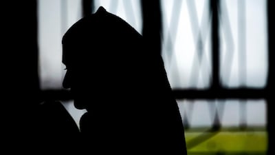 An Iraqi Yazidi woman rescued from ISIS waiting to board buses bound for Sinjar in Iraq's Yazidi heartland. AFP