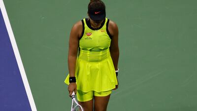 Naomi Osaka of Japan walks with her head down after losing a point. EPA