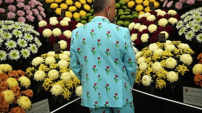 An exhibitor looks at a stand of Chrysanthemum at the 2014 Chelsea Flower Show at Royal Hospital Chelsea on May 19, 2014 in London, England. The prestigious gardening show opens to the general public on May 20, 2014, and features hundreds of stands and exhibition gardens. Dan Kitwood / Getty Images