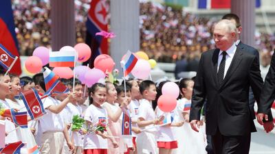 Children greet Mr Putin at the ceremony. EPA / Sputnik