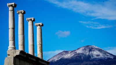 The first snow on Vesuvius volcano is seen from the ruins of the archaeological site of Pompeii, near Naples, Italy. EPA
