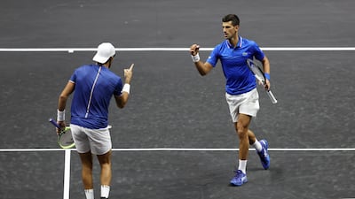 Novak Djokovic and Matteo Berrettini celebrate a point during their doubles match at the Laver Cup. Getty