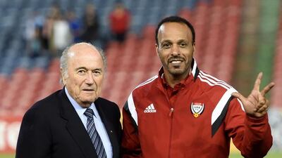 Another member of the UAE staff alongside Fifa president Sepp Blatter.
