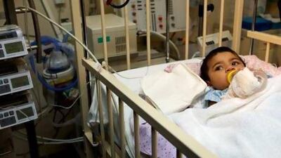 One-year-old Maryam Atia recovering from a free heart surgery received through the Dubai Health Authority's Nabadat humanitarian initiative at Dubai Hospital. Christopher Pike / The National