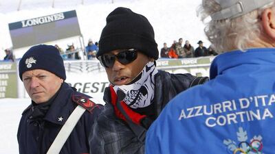 Tiger Woods appears with a missing tooth, supporting girlfriend Lindsey Vonn at the Alpine Skiing World Cup on Monday. Andrea Solero / EPA / January 19, 2015