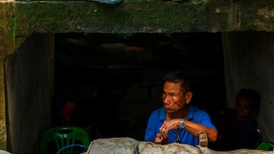 A man looks out from a bunker in Sisaket province as Cambodia and Thailand each said the other had launched artillery attacks across contested border areas early on July 27, hours after US President Donald Trump said the leaders of both countries had agreed to work on a ceasefire. Reuters