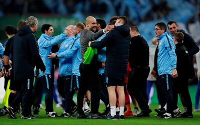 Manchester City manager Pep Guardiola, centre, has paid tribute to predecessor Manuel Pellegrini. Andrew Couldridge / Reuters