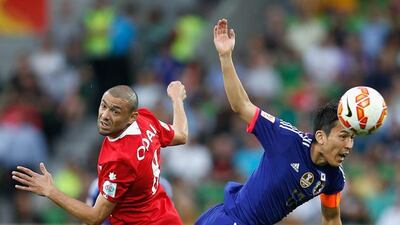 Japan's Makoto Hasebe, right. Darrian Traynor / Getty Images