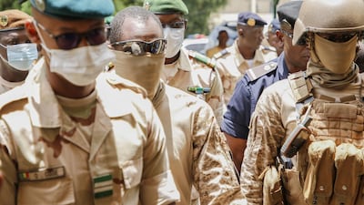 President of the CNSP, the junta that ousted President Keita last week, surrounded by Malian special forces, arrives at the transitional talks with ECOWAS on August 24, 2020 in Bamako, Mali Getty