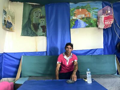 Riad Dawood, 45, a Syrian who has lived in Greece for two years and seven months, spends his mornings at Gold Cafe to escape the boredom of a caravan. September 14, 2018. Anna Zacharias / The National