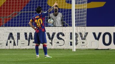 Lionel Messi celebrates towards the empty stands after scoring Barcelona's second goal. Getty Images