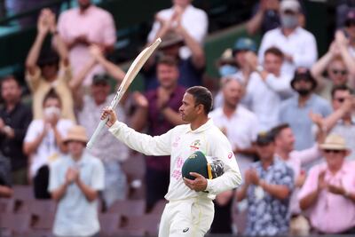 Australia's Usman Khawaja acknowledges applause from spectators as he walks back to the pavilion. AFP