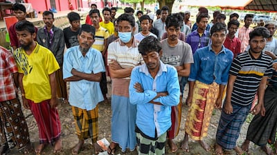Rohingya refugees gather for identity checks in Laweueng, Indonesia. AFP