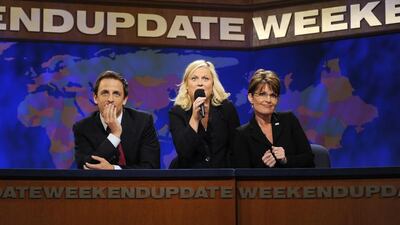 Cast members Amy Poehler, centre, and Seth Meyers, left, perform a skit with Republican vice-presidential nominee Alaska Governor Sarah Palin during an episode of Saturday Night Live in New York. Dana Edelson / Reuters