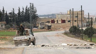 Opposition fighters backing Turkish troops in the village of Hazwan on the outskirts of the Syrian town of Al Bab on February 12, 2017 as they advance towards the town which is the last stronghold of ISIL in Aleppo province, Syria. Rafat Ahmad / AFP