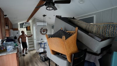Furniture piled high in the canal-front second home of Victor Cassano in Suwannee, Florida as he prepares for the expected arrival of Hurricane Idalia. AP