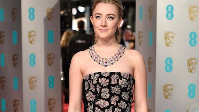 Saoirse Ronan, wearing Burberry, arrives at the British Academy Film Awards on February 14, 2016. EPA