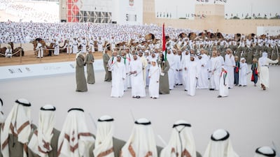 Sheikh Khalifa bin Tahnoun, Executive Director of the Martyrs' Families' Affairs Office; Lt Gen Sheikh Saif bin Zayed, Deputy Prime Minister and Minister of Interior; and Sheikh Hamdan bin Mansour participate in a traditional ayyala. Rashed Al Mansoori / Presidential Court