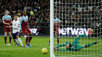 Liverpool's Roberto Firmino and Mohamed Salah look on as the ball goes past the goal during their match against West Ham. Reuters