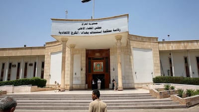Men walk out of Baghdad's Karkh main appeals court building in the western sector of the Iraqi capital. AFP