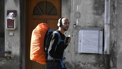 Abdelghani Merah, the elder brother of Mohamed Merah who murdered seven people in southwestern France in 2012, walks along the country's major N7 road on February 16, 2017 as part of a personal campaign to combat extremism. Philippe Desmazes / AFP Photo