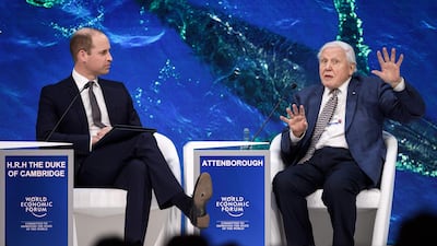 Britain's Prince William, Duke of Cambridge, and British naturalist David Attenborough on stage in Davos. AFP