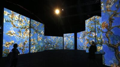 People visit the Van Gogh Alive exhibition in St. Petersburg, September 11, 2014. More than 3,000 images associated with the life and work of Van Gogh are on display during the exhibition. Alexander Demianchuk / Reuters