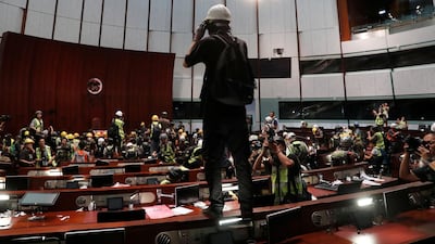 Protesters are seen inside a chamber after they broke into the Legislative Council building. Reuters