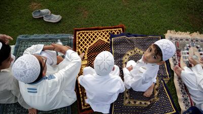 Men and children take part in the Eid Al Fitr prayers in Panama City, Panama.