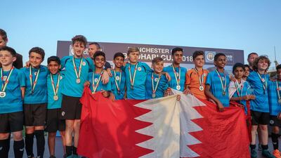 Tekkers Blue team, from Bahrain celebrates after winning the U-14 trophy at the Manchester City Abu Dhabi Cup. Victor Besa / The National
