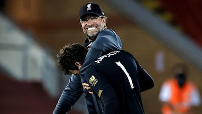 Jurgen Klopp with goalkeeper Alisson. EPA