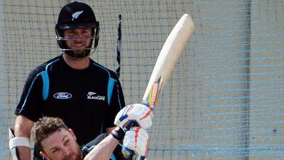 New Zealand cricket captain Brendon McCullum plays a shot as teammate Mark Craig looks on during net practice session at the Sharjah Cricket Stadium on November 24, 2014. The series-deciding third Test between Pakistan and New Zealand starts at Sharjah on November 26, 2014. Aamir Qureshi / AFP