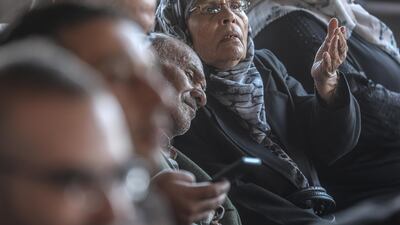 A Palestinian elderly couple wait to cross into Egypt through the Rafah border crossing. EPA