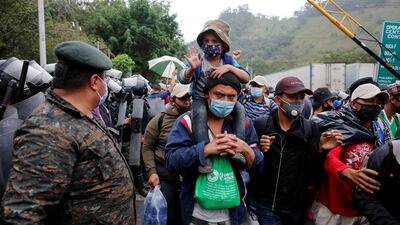 Honduran migrants cross the border in El Florido, Guatemala. Reuters