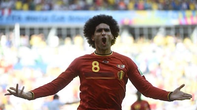 Marouane Fellaini celebrates his equaliser against Algeria for Belgium in their 2014 World Cup Group H match on Tuesday. Martin Bureau / AFP / June 17, 2014
