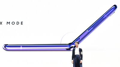 he smartphone flips open, like a pocket cosmetics case, opening into a 6.7-inch screen. AFP