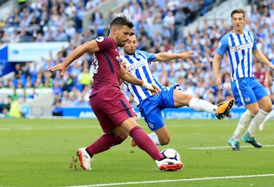 Manchester City's Sergio Aguero, left, and Brighton's Markus Suttner battle for the ball during the Premier League match at the AMEX Stadium, Brighton, England, Saturday August 12, 2017. Gareth Fuller / PA
