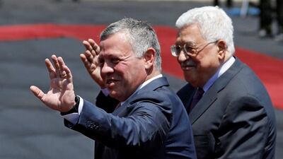 Jordan's King Abdullah and Palestinian president Mahmoud Abbas wave during a reception ceremony in the West Bank city of Ramallah on August 7, 2017. Mohamad Torokman / Reuters