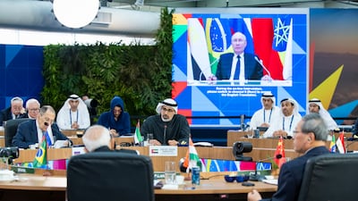 Sheikh Khaled bin Mohamed, Crown Prince of Abu Dhabi, with Russia's President Vladimir Putin projected on a screen during the first plenary session of the Brics summit in Rio de Janeiro. UAE Presidential Court