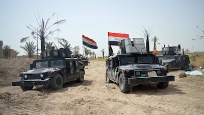 Iraqi security forces vehicles drive through Shuhadaa neighborhood in Fallujah, Iraq. Photo: Reuters