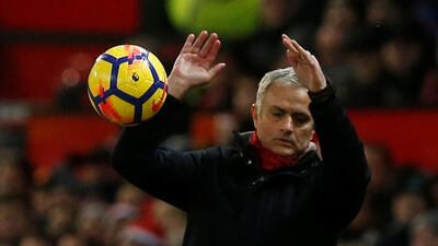 Jose Mourinho stops the ball during Manchester United's 2-2 draw against Burnley at Old Trafford. Andrew Yates / Reuters