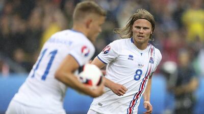 Birkir Bjarnason, right, celebrates after scoring his side’s second goal. Thibault Camus / AP Photo