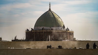 Reconstruction efforts under way on Al Nuri Mosque's dome in Mosul, which was blown up by ISIS militants as they retreated from the city in 2017. Aymen Al-Ameri / The National