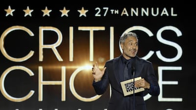 Taika Waititi presenting an award. Getty Images / AFP