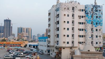 El Seed's latest work adorns a residential tower at the junction of Ajman's Badr and Al Ittihad Streets.