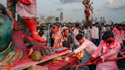 Hindus revellers get ready to immerse a statue of Ganesha into the sea during a procession in Mumbai, India. Getty Images