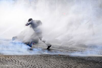 Tear gas was deployed against more boisterous protesters by the French police. AFP